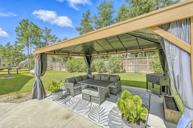 16413 Stonewall St, Conroe, TX 77303 - fenced backyard with outdoor lounge area, a gazebo, and a patio area