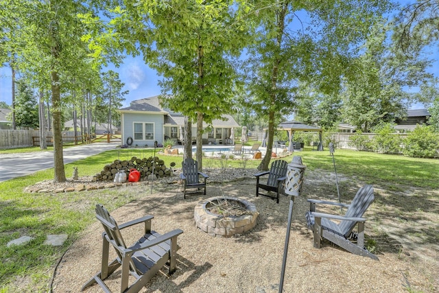 16413 Stonewall St, Conroe, TX 77303 - view of yard with a fire pit