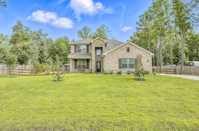 16413 Stonewall St, Conroe, TX 77303 - view of front facade with brick siding and a fenced backyard