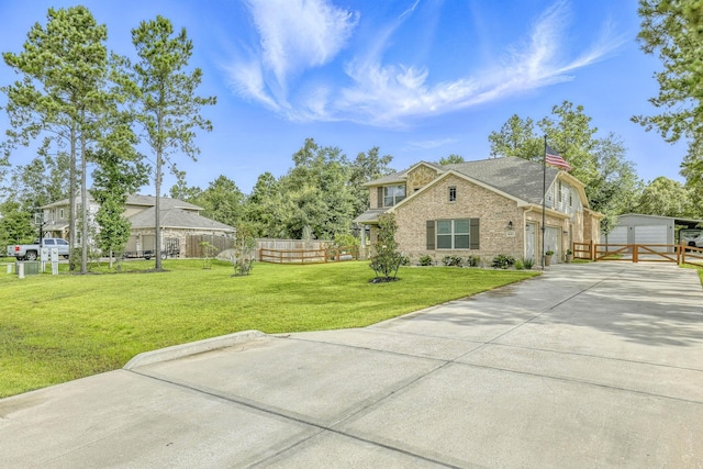 16413 Stonewall St, Conroe, TX 77303 - view of side of home featuring brick siding, driveway, and an outbuilding