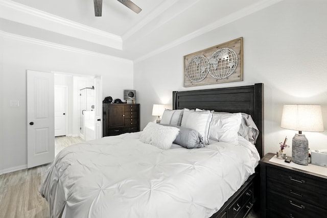16413 Stonewall St, Conroe, TX 77303 - bedroom featuring light wood-style flooring, a tray ceiling, crown molding, connected bathroom, and ceiling fan