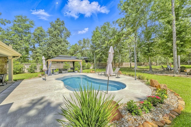16413 Stonewall St, Conroe, TX 77303 - view of swimming pool featuring a gazebo, a patio area, and a fenced backyard