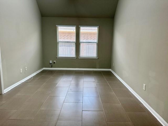 19522 Brighton Brook Ln, Richmond, TX 77407 - spare room featuring tile patterned floors and baseboards