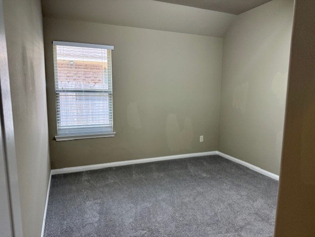 19522 Brighton Brook Ln, Richmond, TX 77407 - spare room featuring dark colored carpet and vaulted ceiling