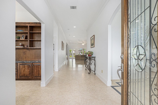 4606 Silhouette Dr, Katy, TX 77493 - entrance foyer featuring arched walkways, ornamental molding, and recessed lighting