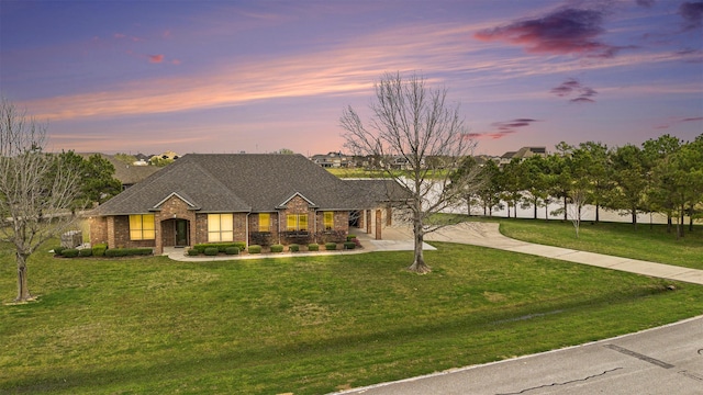4606 Silhouette Dr, Katy, TX 77493 - view of front of property with brick siding, a front yard, and a shingled roof