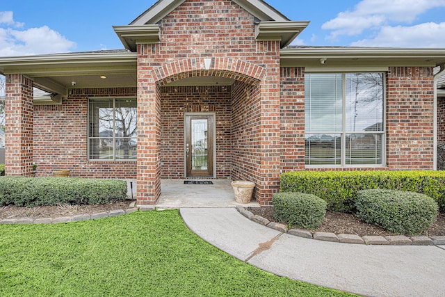 4606 Silhouette Dr, Katy, TX 77493 - property entrance featuring brick siding and a lawn