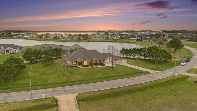 4606 Silhouette Dr, Katy, TX 77493 - aerial view at dusk of a water view and a residential view