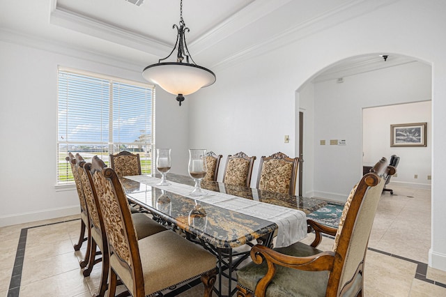 4606 Silhouette Dr, Katy, TX 77493 - dining room with arched walkways, inlaid floor details, light tile patterned floors, ornamental molding, and a raised ceiling