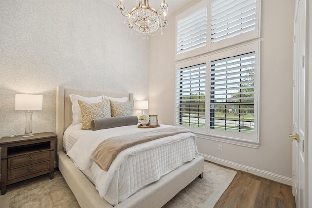 631 Rita Blanca Dr, Webster, TX 77598 - bedroom featuring a chandelier and wood finished floors