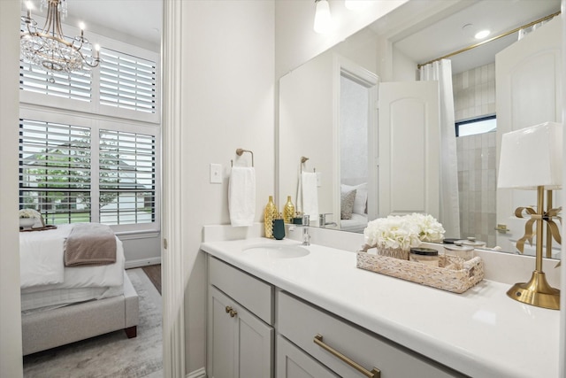 631 Rita Blanca Dr, Webster, TX 77598 - bathroom featuring connected bathroom, vanity, a chandelier, a shower, and wood finished floors
