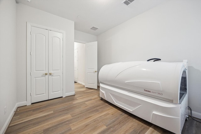 631 Rita Blanca Dr, Webster, TX 77598 - bedroom with wood finished floors and a closet