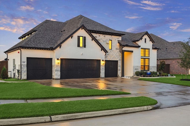 631 Rita Blanca Dr, Webster, TX 77598 - view of front of house with stone siding, concrete driveway, a front yard, an attached garage, and roof with shingles