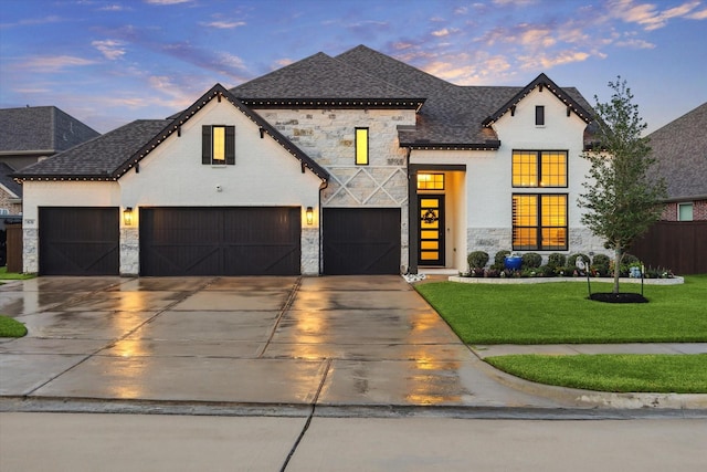 631 Rita Blanca Dr, Webster, TX 77598 - view of front facade with stone siding, concrete driveway, and roof with shingles