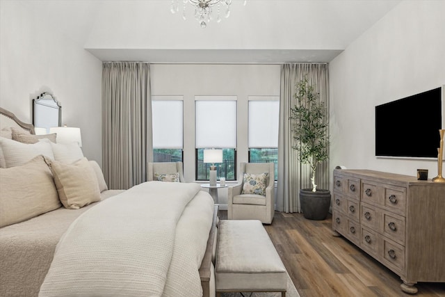 631 Rita Blanca Dr, Webster, TX 77598 - bedroom featuring wood finished floors and a chandelier