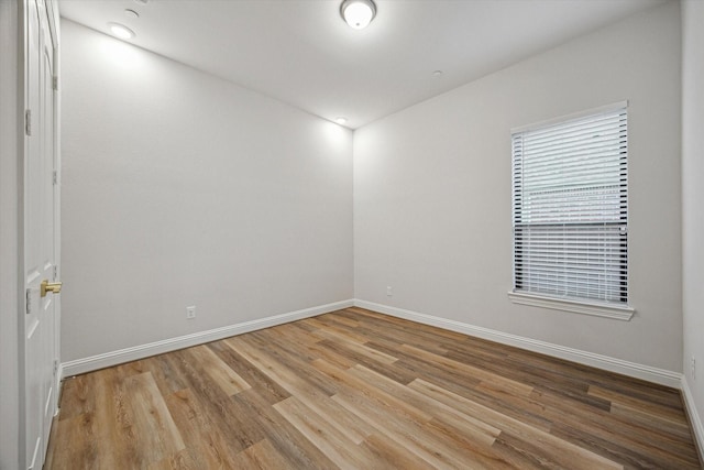 631 Rita Blanca Dr, Webster, TX 77598 - empty room featuring baseboards and wood finished floors