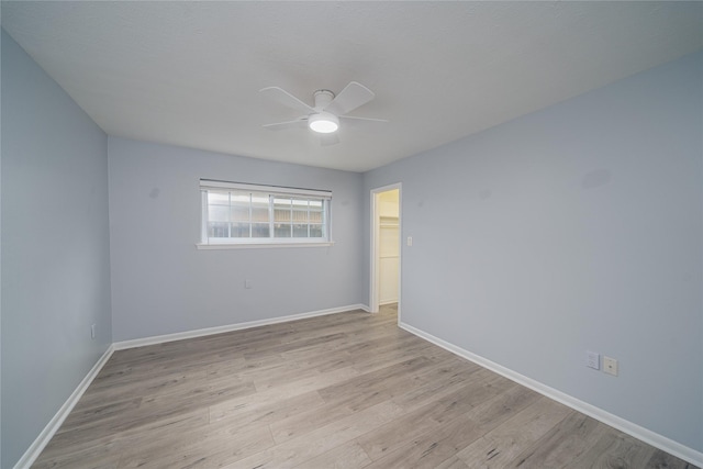 7602 Jackwood St, Houston, TX 77074 - spare room featuring a ceiling fan and light wood-style flooring