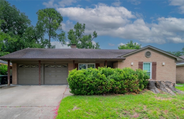 7602 Jackwood St, Houston, TX 77074 - ranch-style house featuring an attached garage, driveway, a chimney, and brick siding