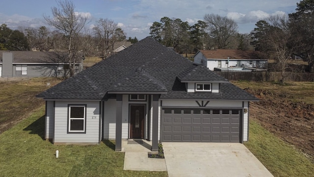 175 Deep Woods Ln, Livingston, TX 77351 - view of front of property featuring roof with shingles, a front lawn, and concrete driveway