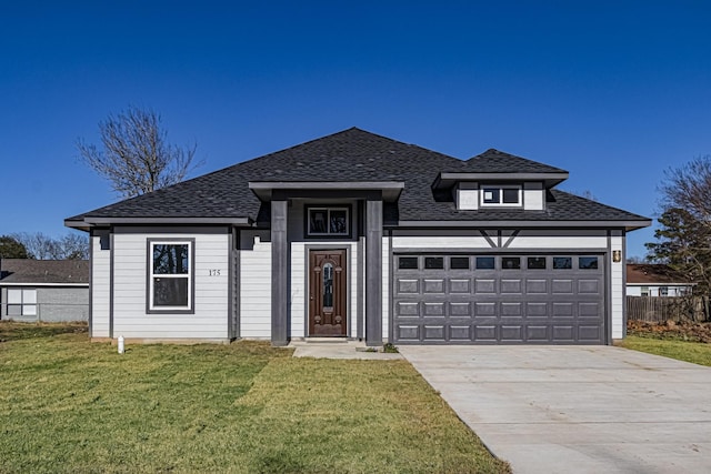 175 Deep Woods Ln, Livingston, TX 77351 - view of front of home with a shingled roof, concrete driveway, and a garage