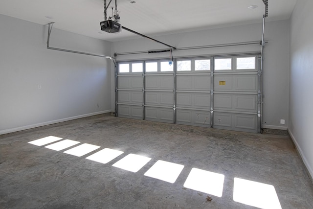 175 Deep Woods Ln, Livingston, TX 77351 - garage with a garage door opener and baseboards