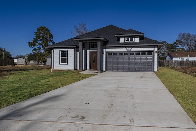 175 Deep Woods Ln, Livingston, TX 77351 - view of front of home featuring driveway, an attached garage, and a shingled roof