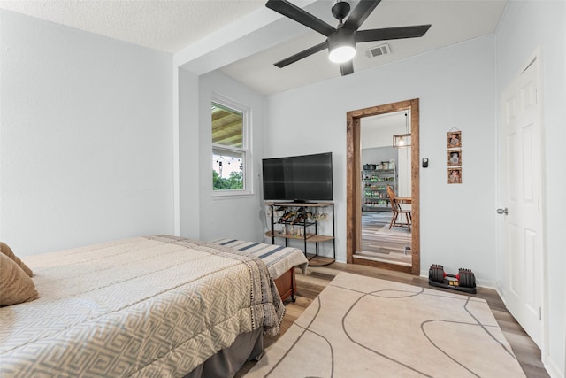 703 Pecan Valley Dr, Wharton, TX 77488 - bedroom featuring wood finished floors and a ceiling fan
