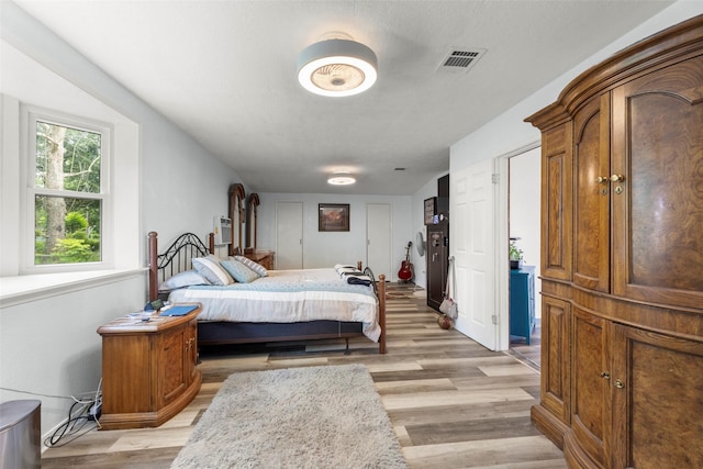 703 Pecan Valley Dr, Wharton, TX 77488 - bedroom featuring light wood finished floors