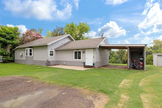703 Pecan Valley Dr, Wharton, TX 77488 - rear view of house with a lawn, a patio area, and roof with shingles