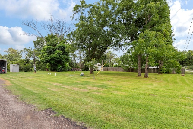 703 Pecan Valley Dr, Wharton, TX 77488 - view of yard featuring a storage shed