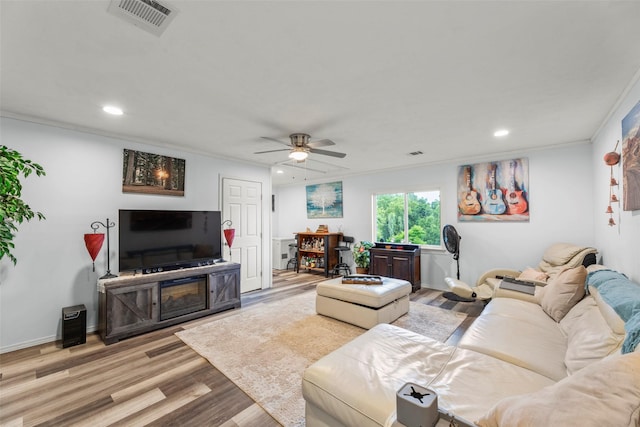 703 Pecan Valley Dr, Wharton, TX 77488 - living room featuring recessed lighting, a ceiling fan, light wood-style flooring, and ornamental molding