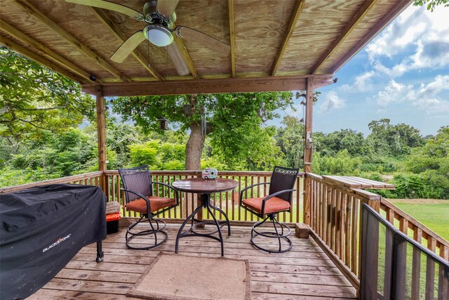 703 Pecan Valley Dr, Wharton, TX 77488 - deck featuring a ceiling fan, grilling area, and view of scattered trees