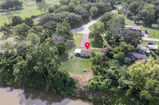 703 Pecan Valley Dr, Wharton, TX 77488 - drone / aerial view of a nearby body of water and a tree filled landscape