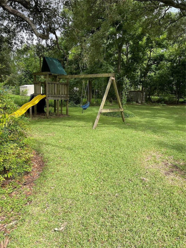 507 Oak Dr, Lake Jackson, TX 77566 - view of grassy yard with a playground