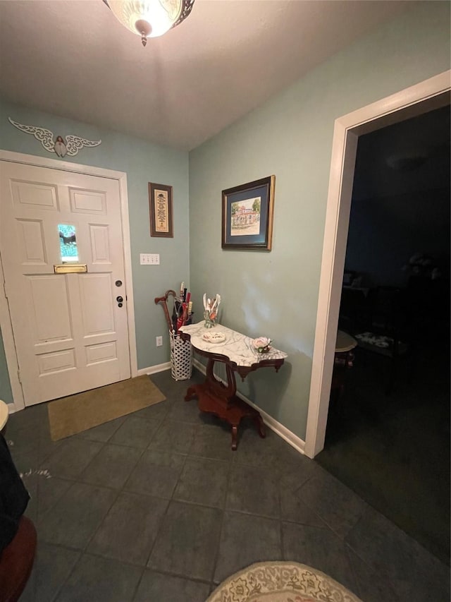 507 Oak Dr, Lake Jackson, TX 77566 - entrance foyer with dark tile patterned flooring and baseboards