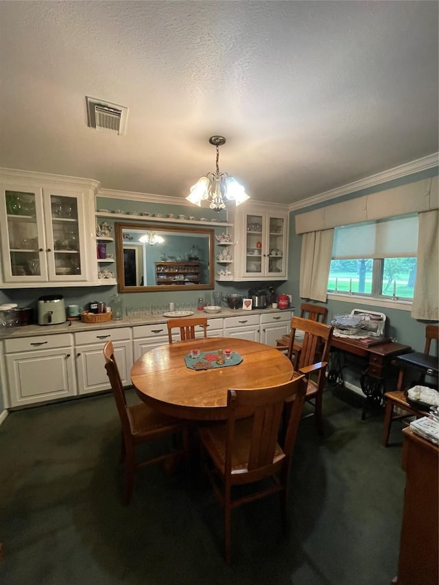 507 Oak Dr, Lake Jackson, TX 77566 - dining area featuring a chandelier, crown molding, and dark carpet
