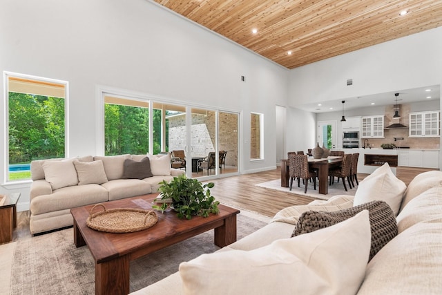 25203 Elijah Ct, Tomball, TX 77375 - living room with wooden ceiling, a towering ceiling, recessed lighting, and light wood-type flooring