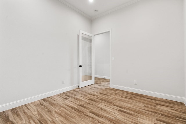 25203 Elijah Ct, Tomball, TX 77375 - unfurnished room featuring crown molding, light wood finished floors, french doors, and a smoke detector