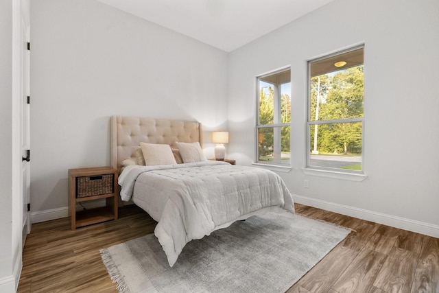 25203 Elijah Ct, Tomball, TX 77375 - bedroom featuring baseboards and wood finished floors