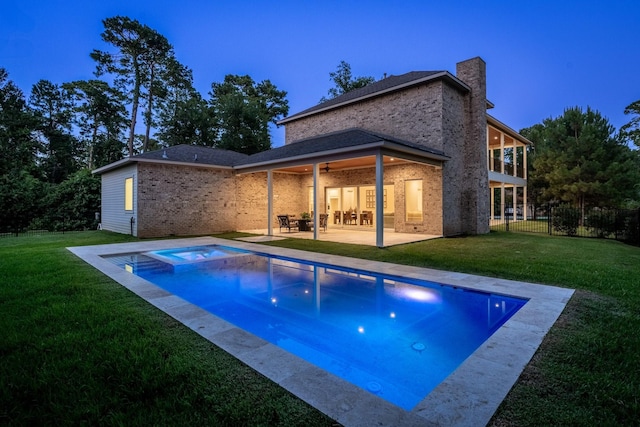 25203 Elijah Ct, Tomball, TX 77375 - rear view of house with a chimney, a patio area, brick siding, and a ceiling fan