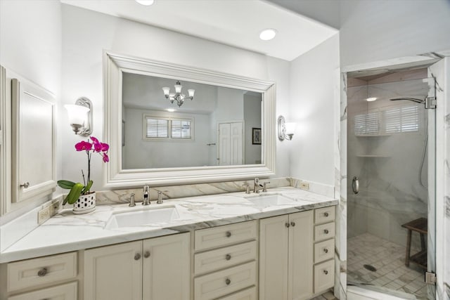 2207 Dunraven Ln, Houston, TX 77019 - bathroom with double vanity, a shower stall, and a chandelier