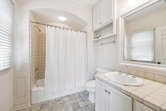 2207 Dunraven Ln, Houston, TX 77019 - full bathroom with vanity, healthy amount of natural light, shower / bath combination with curtain, and stone finish flooring