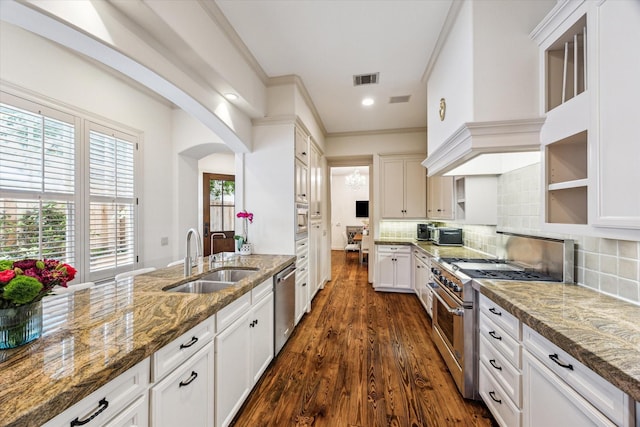 2207 Dunraven Ln, Houston, TX 77019 - kitchen with stainless steel appliances, white cabinets, stone countertops, dark wood-style floors, and recessed lighting