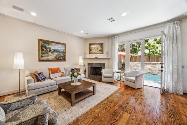 2207 Dunraven Ln, Houston, TX 77019 - living room featuring wood finished floors, a tile fireplace, and recessed lighting