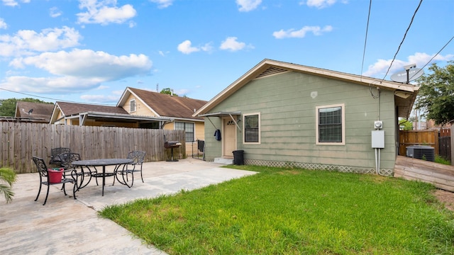 3409 Michigan St, Baytown, TX 77520 - back of property with a patio area and a fenced backyard