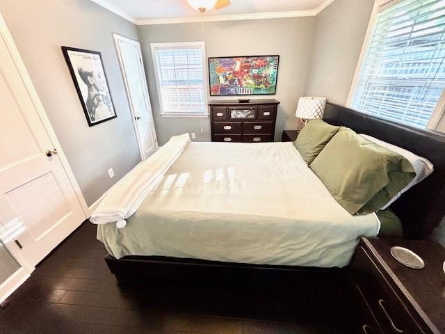 9618 Chatfield St, Houston, TX 77025 - bedroom featuring crown molding and wood-type flooring