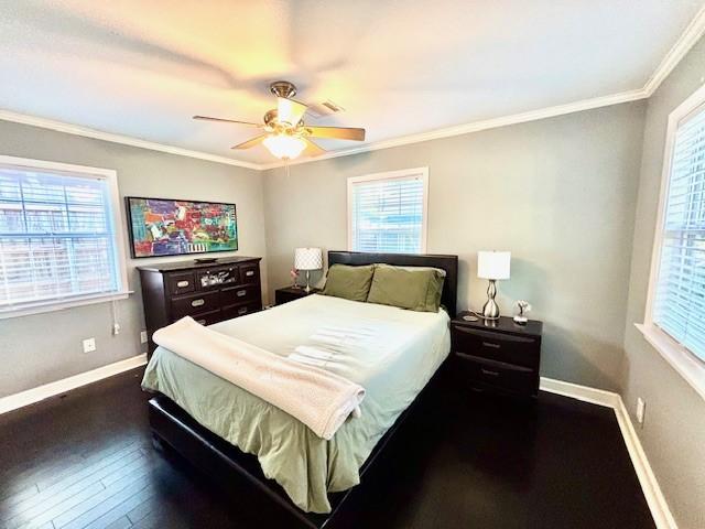 9618 Chatfield St, Houston, TX 77025 - bedroom featuring crown molding, wood finished floors, and a ceiling fan