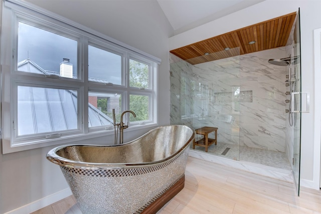 3211 Pittsburg St, West University Place, TX 77005 - full bathroom featuring a freestanding bath, a marble finish shower, lofted ceiling, and wood finished floors