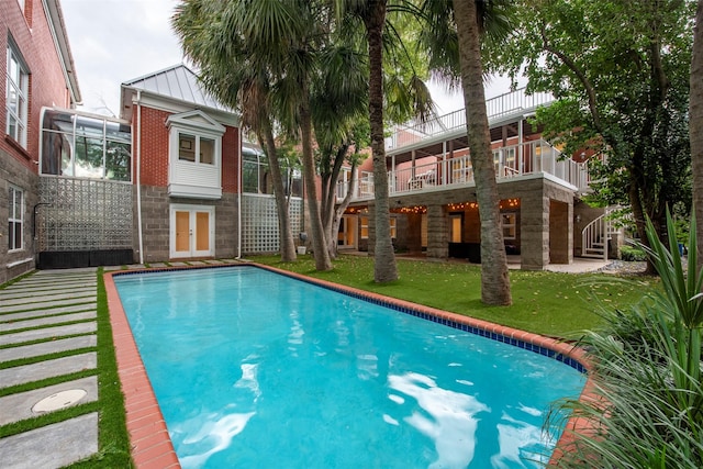 3211 Pittsburg St, West University Place, TX 77005 - outdoor pool featuring a lawn and french doors