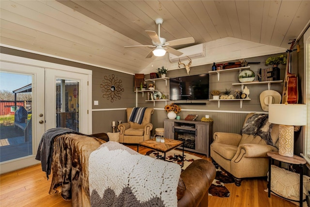 210 N Scott St, Fayetteville, TX 78940 - living room featuring wooden ceiling, lofted ceiling, light wood finished floors, ceiling fan, and wooden walls